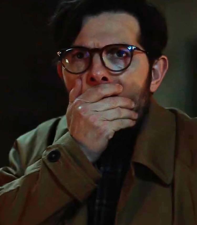 Adam Scott's Ohm looking shocked with his hand over his mouth in Hokum