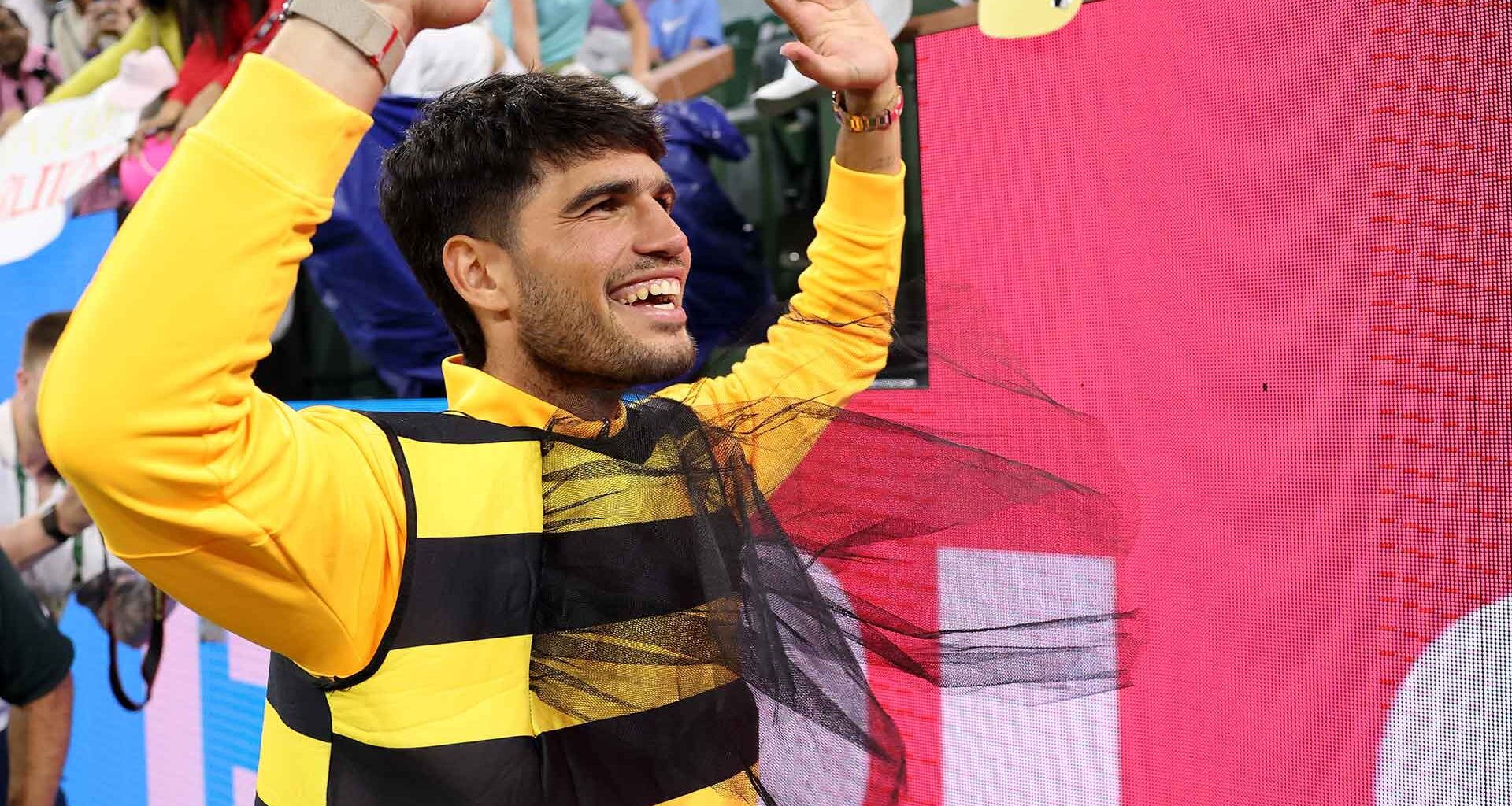 Carlos Alcaraz wears a bee costume following his Indian Wells quarter-final win against Cameron Norrie.