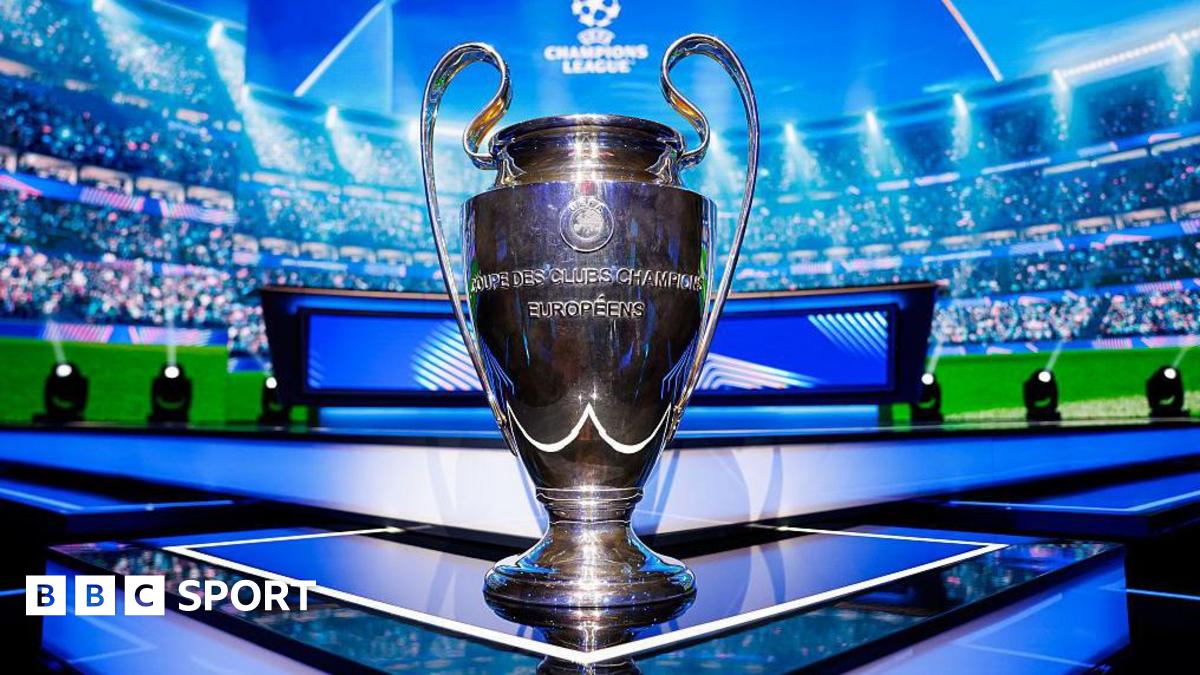 The UEFA Champions League trophy is seen on the stage ahead of the League Phase draw