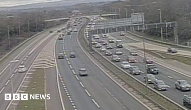 A grainy photo of traffic building up on the M6