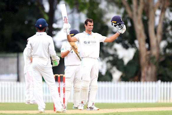 Hugo Burdon after reaching his triple century in the Queensland Premier Cricket first grade final. Batting partner Stephan Muller finished on 272 not out. 