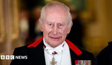 King Charles III standing for a formal photograph before a state banquet