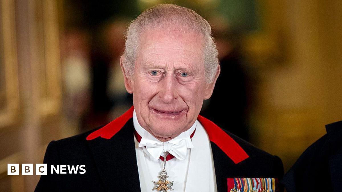 King Charles III standing for a formal photograph before a state banquet