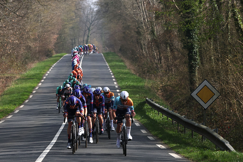The pack rides during the 1st stage of the Paris-Nice cycling race, 170.9 km between Ach&egrave;res and Carri&egrave;res-sous-Poissy, on March 8, 2026. (Photo by Anne-Christine POUJOULAT / AFP)