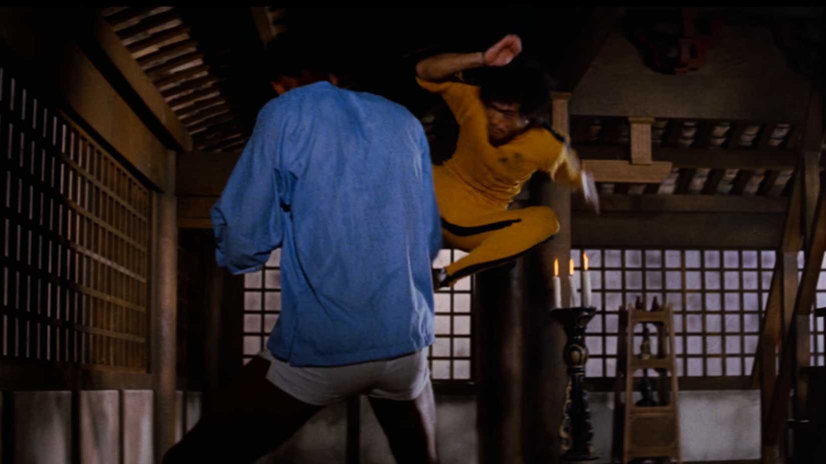 Bruce Lee hitting Hakim with a flying kick in The Game of Death