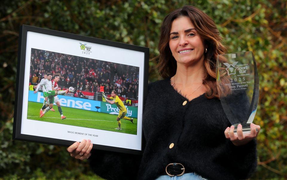 Troy Parrott's mother Jennifer proudly holds his Magic Moment of the Year award