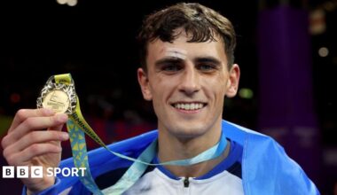 Gold medalist Reese Lynch of Team Scotland celebrates during the Men's Boxing Over 60kg-63.5kg (Light Welterweight) medal ceremony on day ten of the Birmingham 2022 Commonwealth Games at NEC Arena on August 07, 2022 on the Birmingham, England
