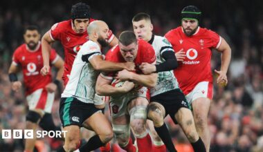Will Rowlands being tackled by Ireland's Jamison Gibson-Park and Sam Prendergast