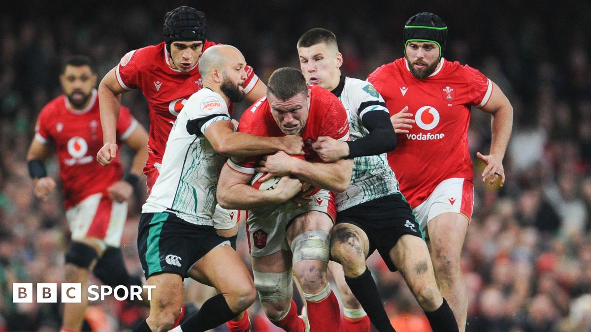 Will Rowlands being tackled by Ireland's Jamison Gibson-Park and Sam Prendergast