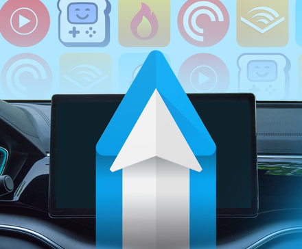 Car dashboard with a central display showing the Android Auto logo, with colorful app icons.