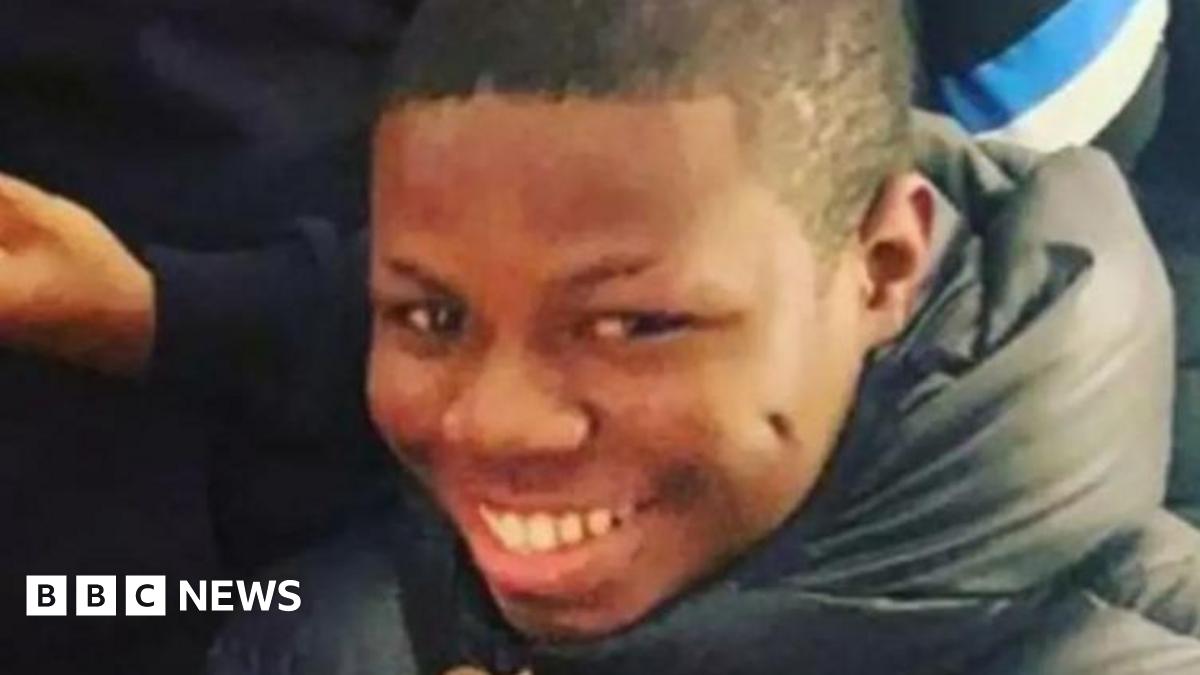 Camron Smith smiling, wearing a black puffer coat.