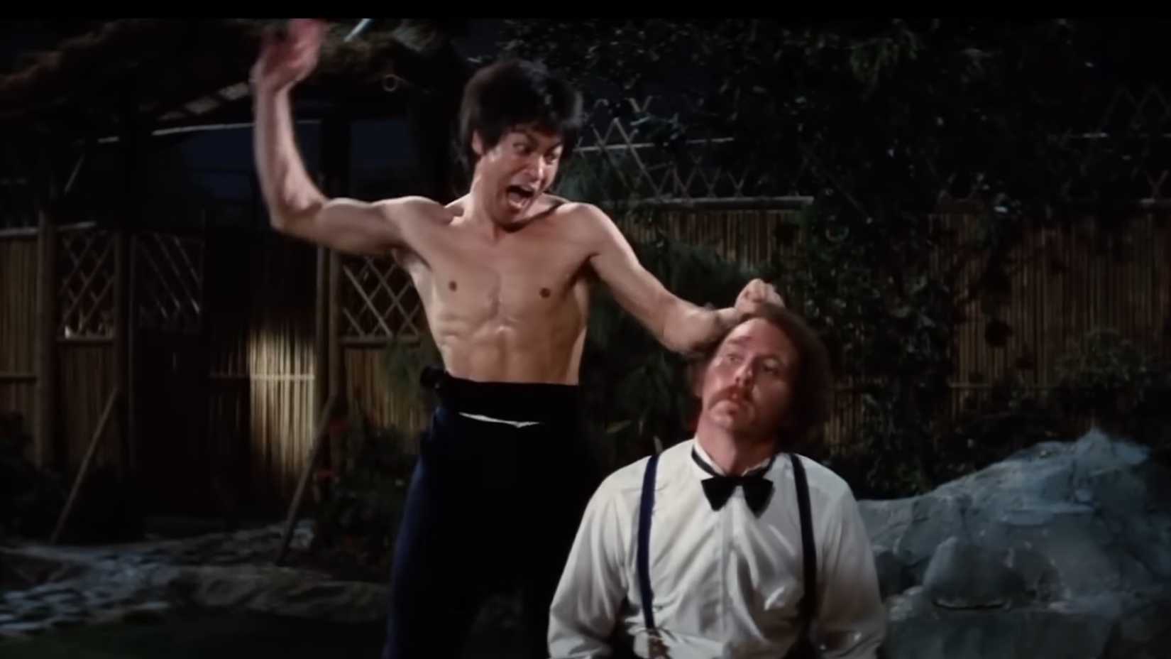 Chen Zhen (Bruce Lee) about to deliver the killing blow against Petrov (Robert Baker) in Fists of Fury
