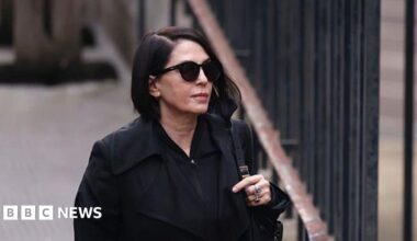 Sadie Frost wearing sunglasses and a black jacket before entering court