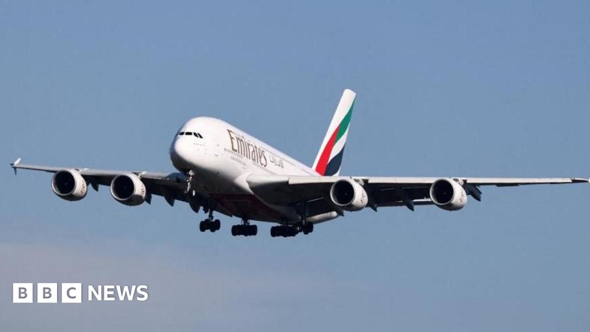 An Emirates aircraft in the sky