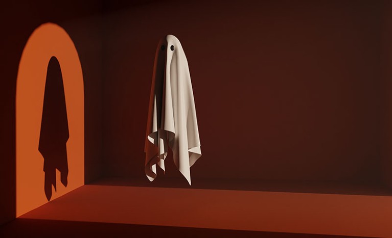 A white ghost floats eerily in a minimal orange room, it is lit from the side and its shadow can be seen on the wall creating a spooky atmosphere
