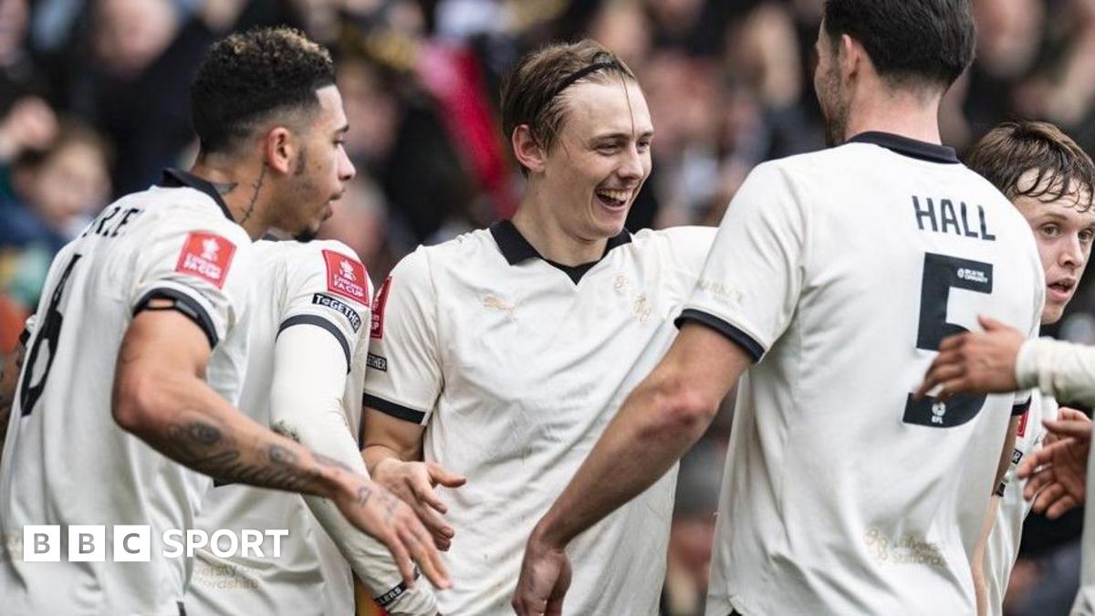 Port Vale's players celebrate after scoring against Sunderland in the FA Cup