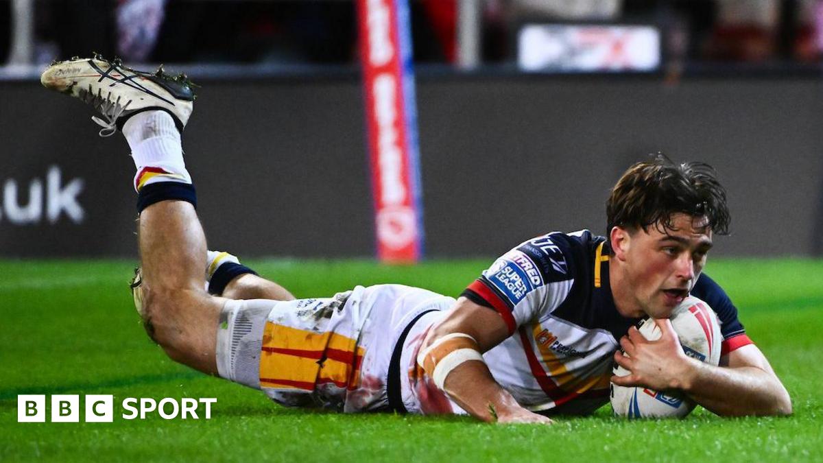 Catalans Dragons' Lewis Dodd diving over to score a try