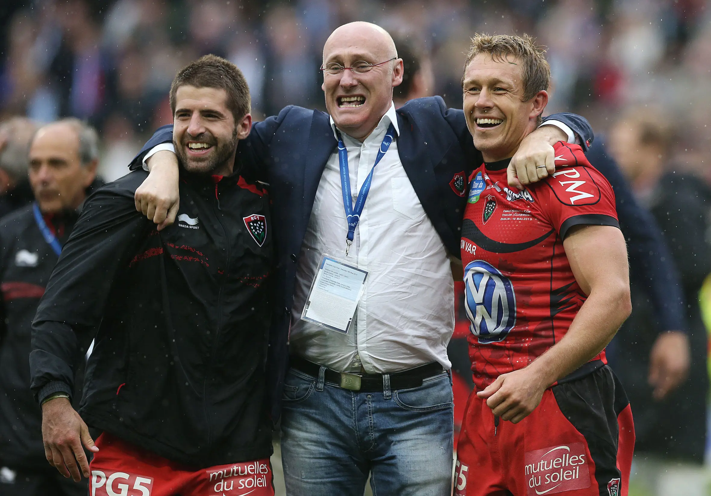 Sebastien Tillous-Borde, Coach Bernard Laporte, and Jonny Wilkinson celebrate their Heineken Cup Final win.