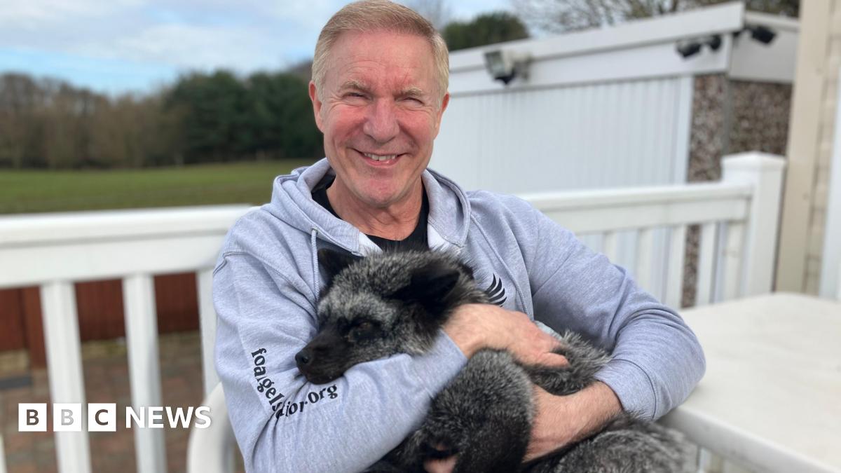 Les Hemstock holding Fern the American silver fox