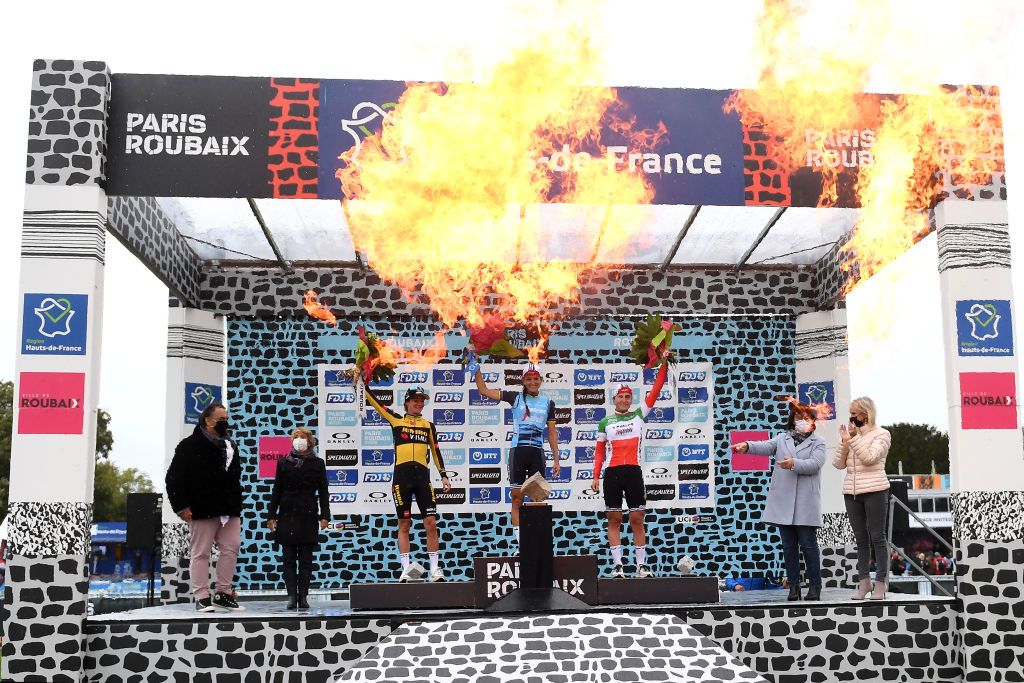 ROUBAIX, FRANCE - OCTOBER 02: (L-R) Marianne Vos of Netherlands and Jumbo Visma Team on second place, stage winner Elisabeth Deignan-Armitstead of United Kingdom and Team Trek - Segafredo and Elisa Longo Borghini of Italy and Team Trek - Segafredo on third place, pose with trophies on the podium during the podium ceremony after the 1st Paris-Roubaix 2021 - Women&amp;apos;s Elite a 116,4km race from Denain to Roubaix / #ParisRoubaixFemmes / #ParisRoubaix / on October 02, 2021 in Roubaix, France. (Photo by Tim de Waele/Getty Images)