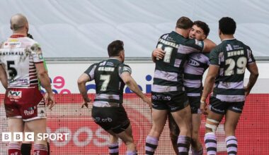 Connor Wrench (right) is mobbed by three team-mates after scoring a try as Liam Marshall (MARSHALL- 5) looks on