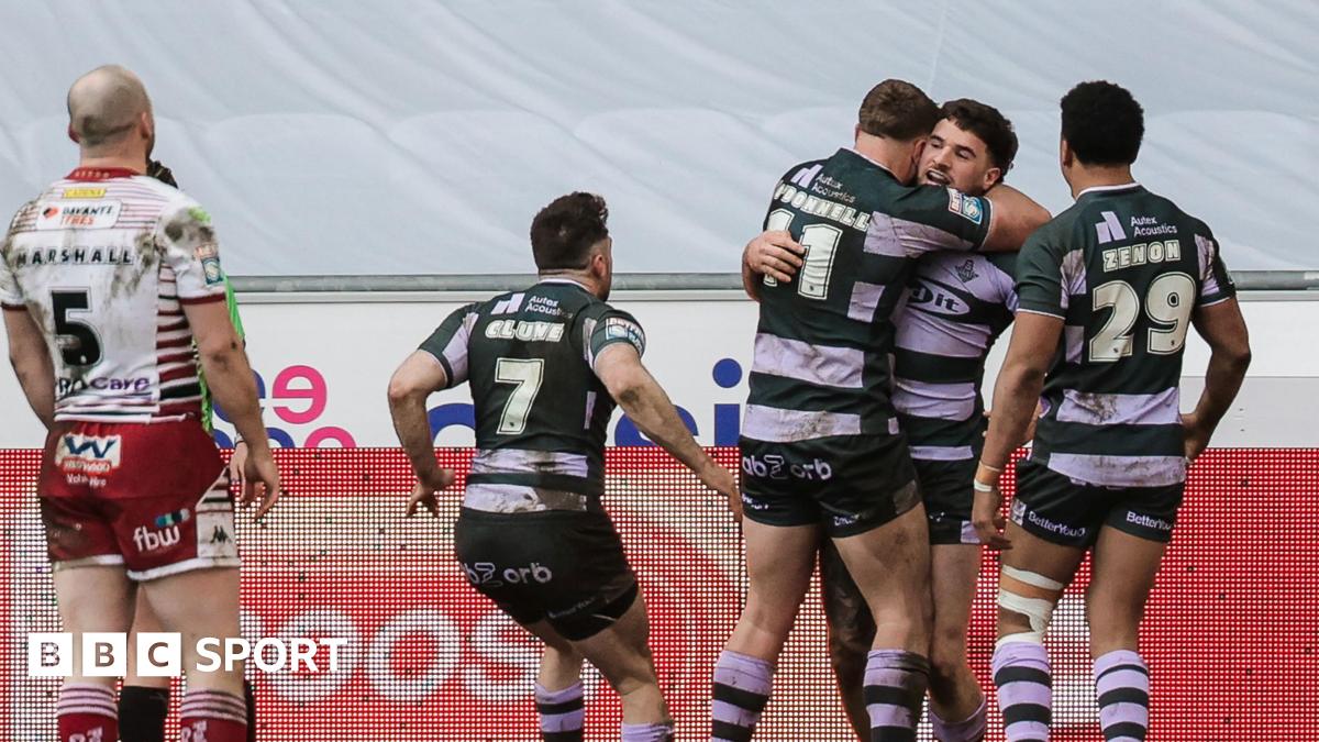 Connor Wrench (right) is mobbed by three team-mates after scoring a try as Liam Marshall (MARSHALL- 5) looks on