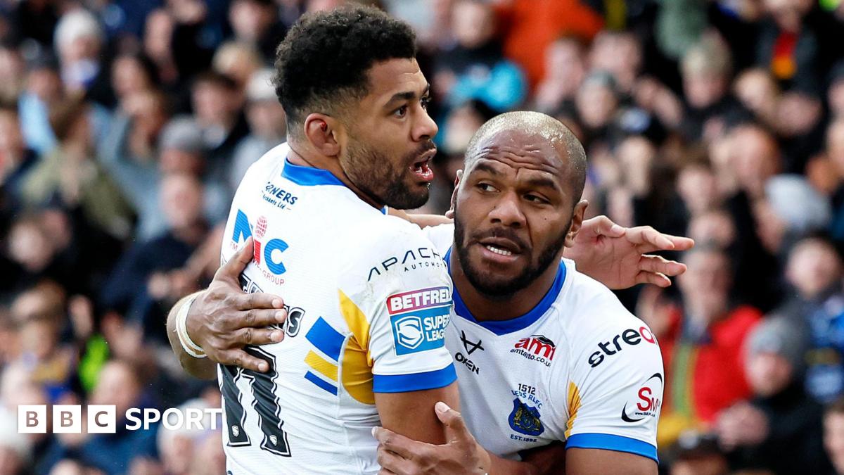 Leeds Rhinos wing Maiko Sivo is hugged by team-mate Kallum Watkins after scoring a try.