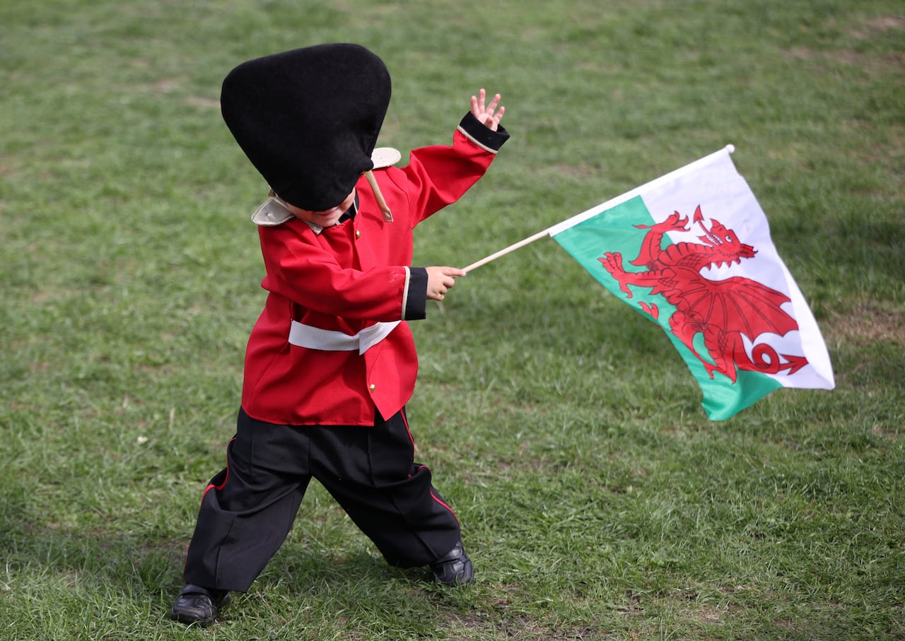 A child waves a Welsh flag in Cardiff, Wales, Britain, September 16, 2022.
