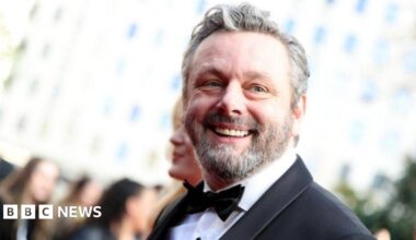 Michael Sheen in a suit and tie