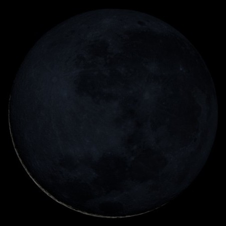 a very thin crescent moon with just a whisper of light illuminating the lower portion of the crescent.