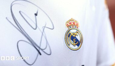 A close up image of a Real Madrid shirt signed by Kylian Mbappe