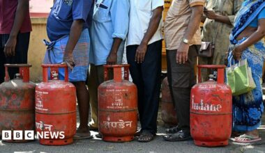 People queue to buy liquefied petroleum gas (LPG) cylinders for domestic use, at a gas agency office in Chennai.
