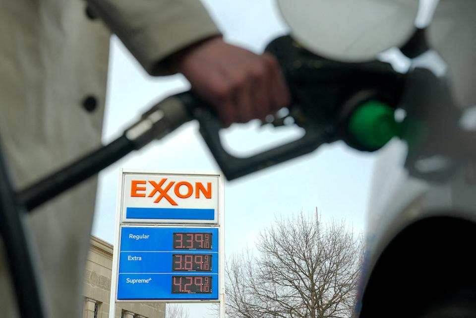 FILE PHOTO: A man pumps gas at an Exxon station as the price of oil and gas has surged amid the U.S.-Israeli conflict with Iran, in Washington, D.C., U.S., March 5, 2026. REUTERS/Ken Cedeno/File Photo