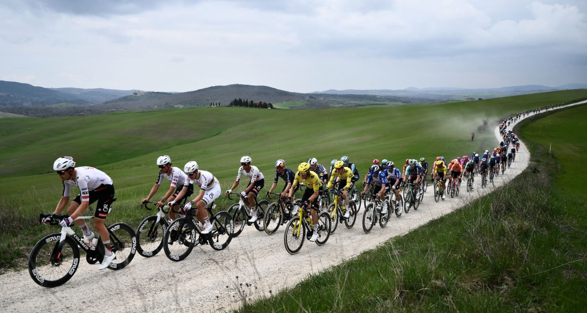 The pack rides during the 20th one-day classic 'Strade Bianche' (White Roads) men's cycling race between Siena and Siena in Tuscany on March 7, 2026. (Photo by Marco BERTORELLO / AFP)