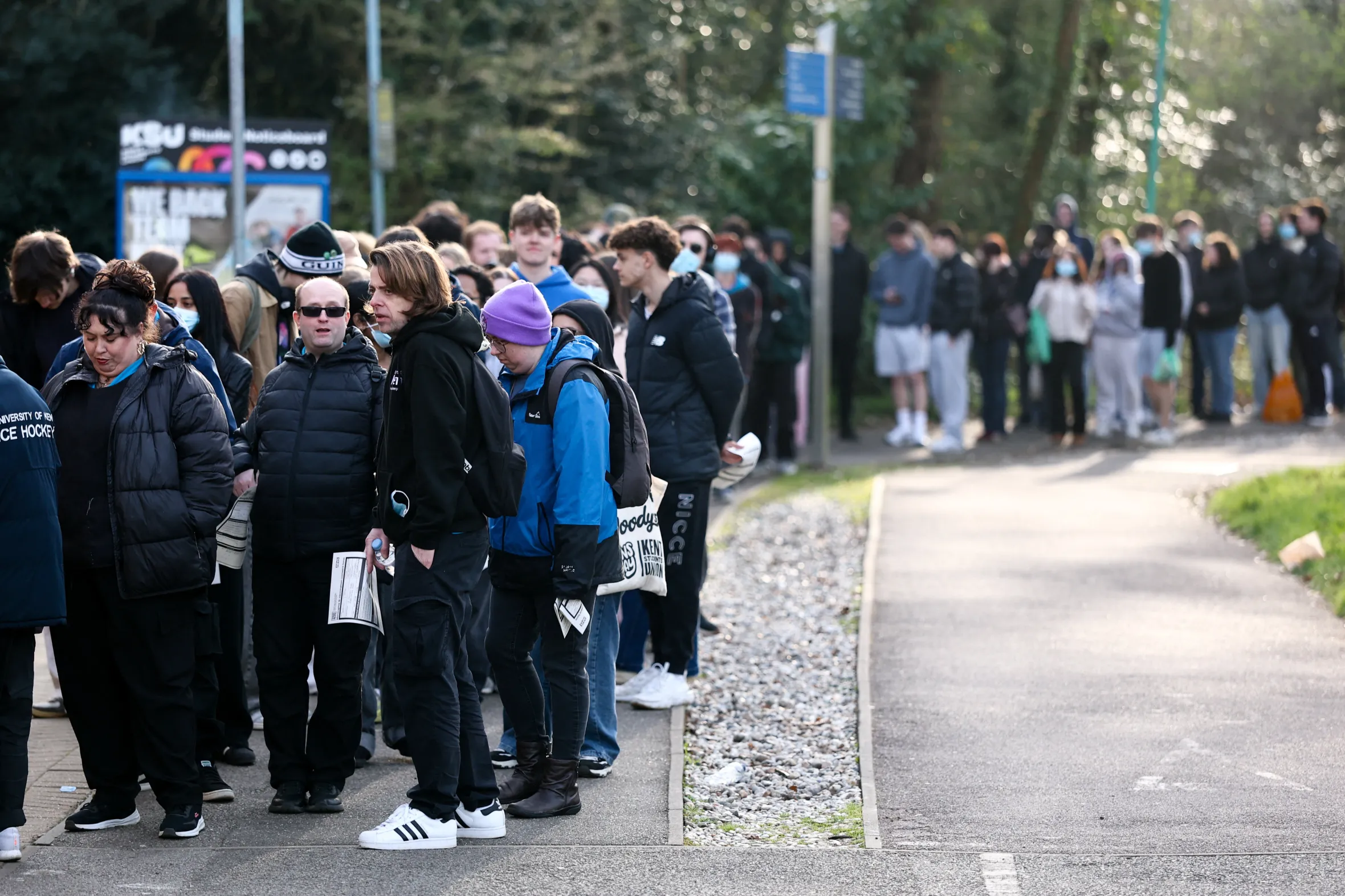 People, mainly students, queuing to receive Meningitis B vaccinations at the University of Kent.