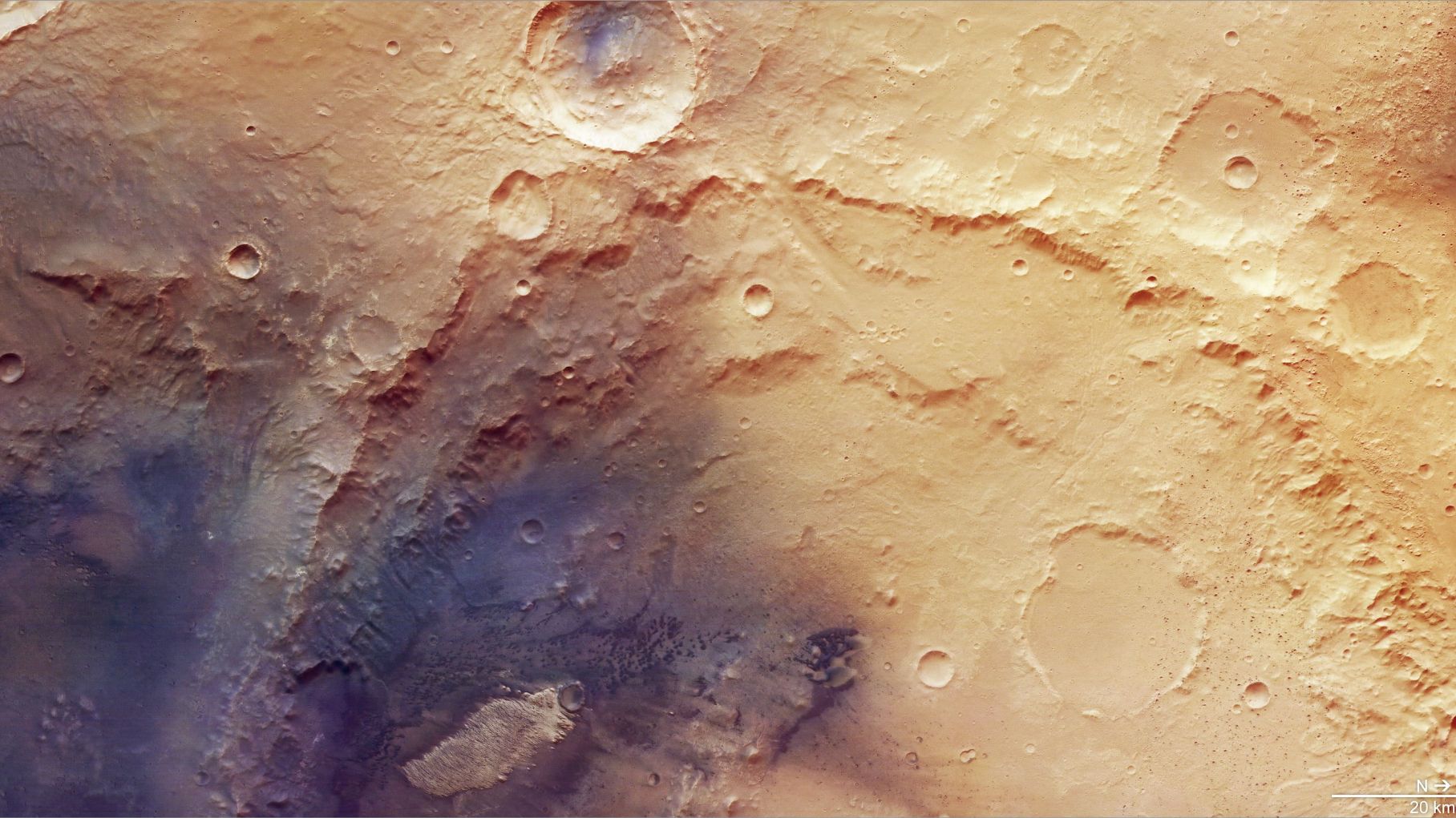 image of the mars surface taken by a mars orbiter, showing several large, heavily eroded craters