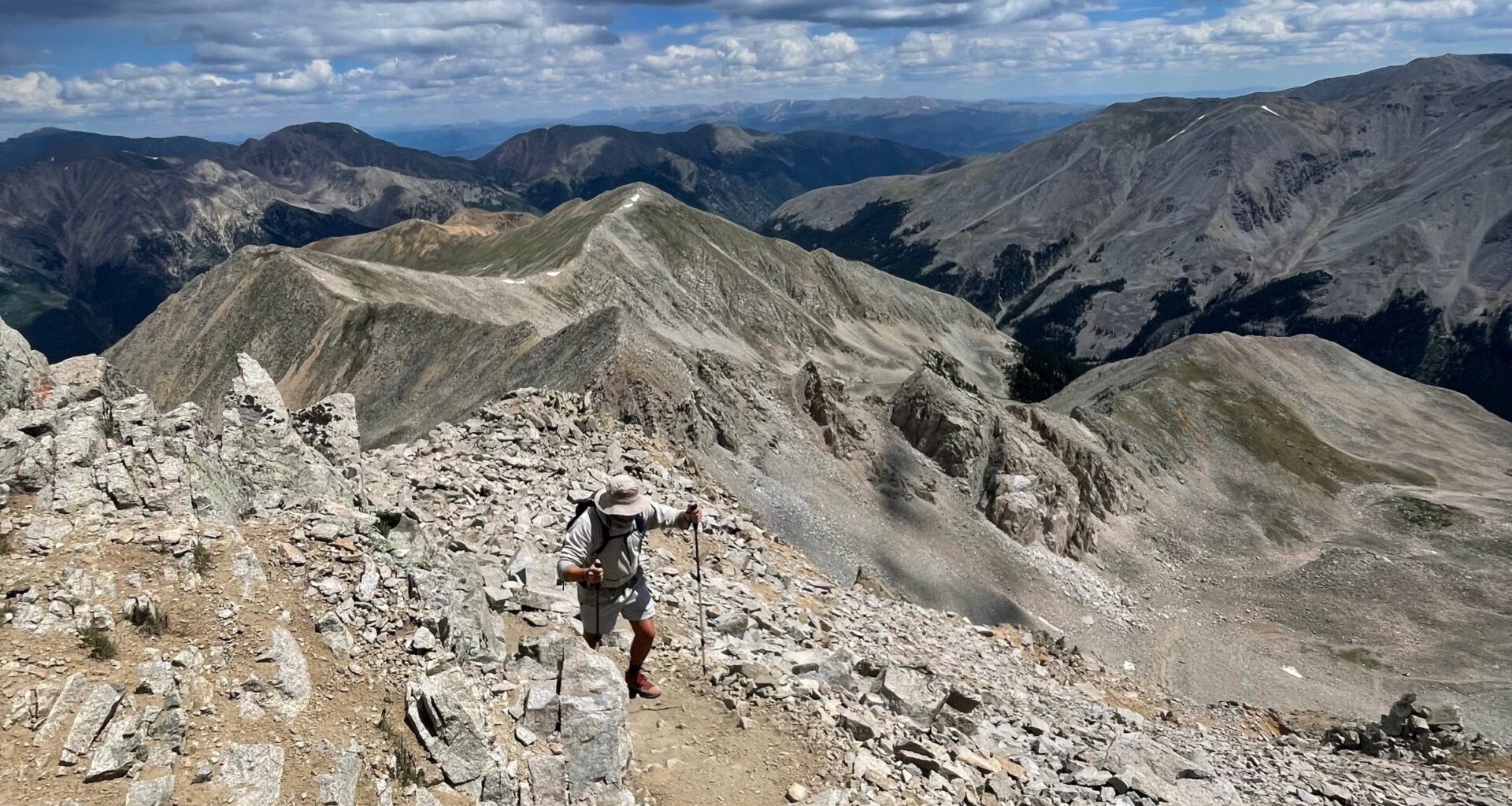 Hiker on talus-covered trail