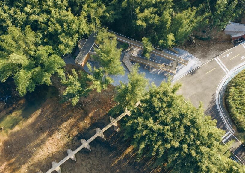 vernacular bridge craftsmanship informs micro-museum set within bamboo grove in china - 1