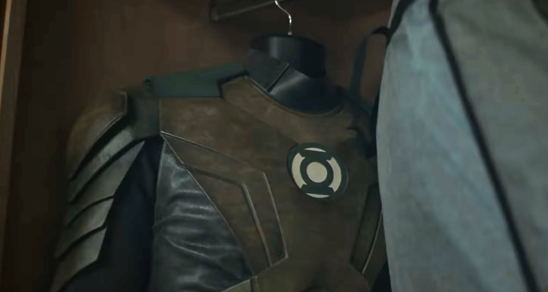 Hal Jordan's brownish Green Lantern uniform hanging in a closet