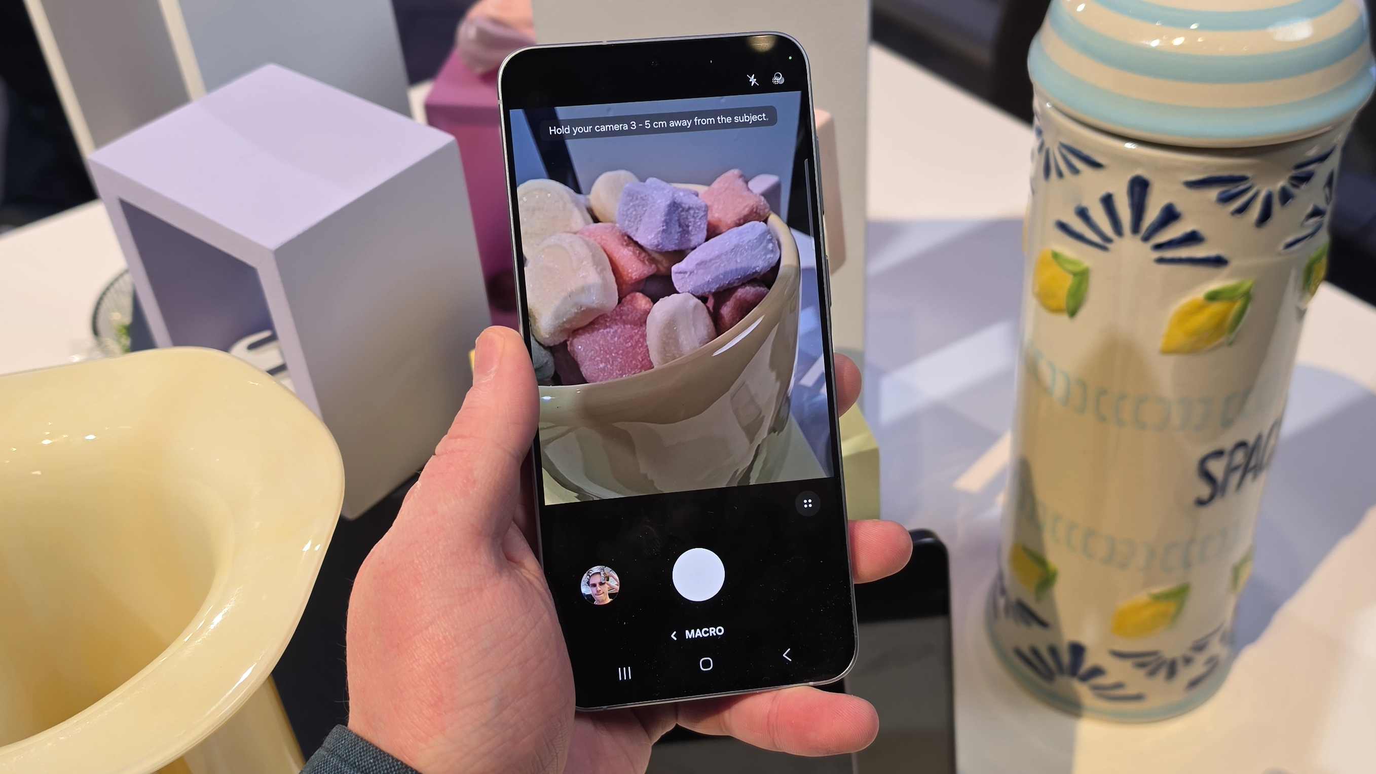The Samsung Galaxy A57 camera app, showing a bowl of sweets.