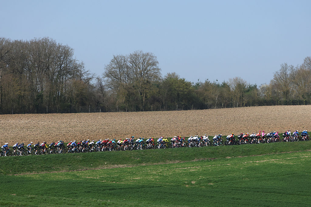 The pack rides during the 1st stage of the Paris-Nice cycling race, 170.9 km between Ach&egrave;res and Carri&egrave;res-sous-Poissy, on March 8, 2026. (Photo by Anne-Christine POUJOULAT / AFP)