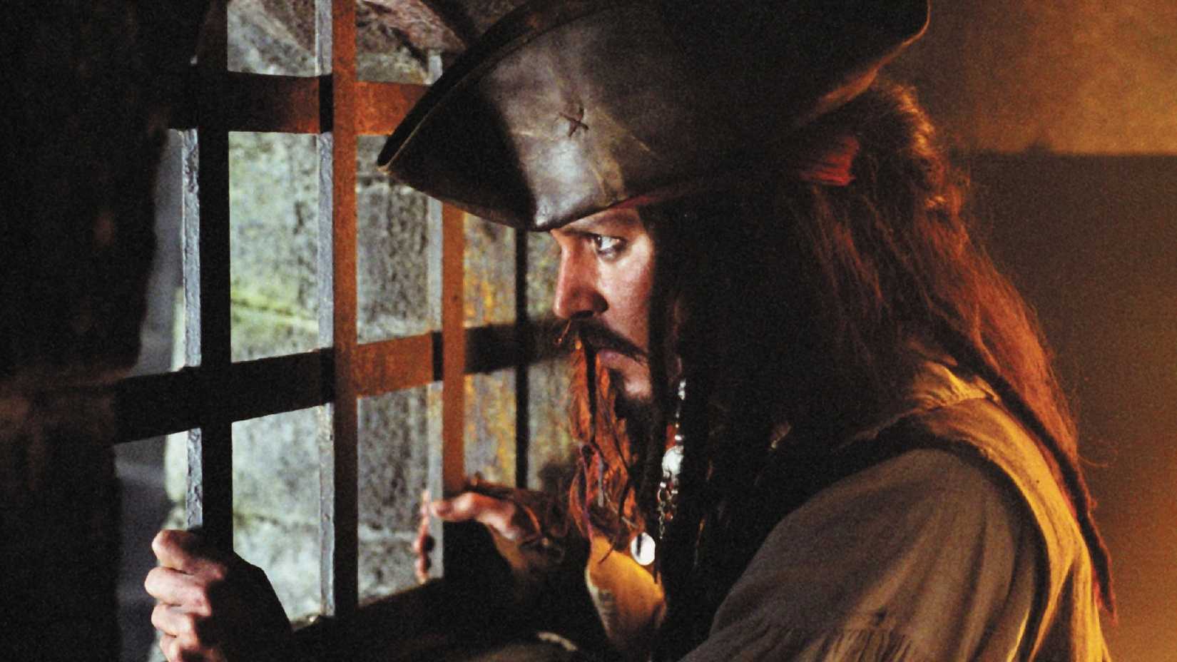 Johnny Depp as Jack Sparrow in prison in Pirates of the Caribbean The Curse of the Black Pearl
