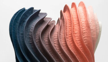 janny baek's sculptures form an abstract ecosystem of colorful ceramic organisms