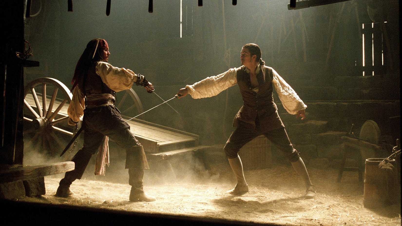 Johnny Depp as Captain Jack Sparrow Swordfighting Orlando Bloom As Will Turner In Pirates of the Caribbean