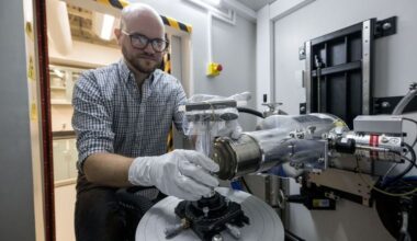 Study co-author and NASA X-ray scientist, Dr. Scott Eckley, seen loading a Bennu sample into an X-ray Computed Tomography (XCT) machine that was used for the study. (Credit: NASA/Robert Markowitz)