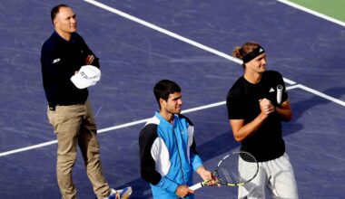Umpire Mohamed Lahyani, Carlos Alcaraz and Alexander Zverev all wait while play is halted due to a bee invasion at Indian Wells in 2024.