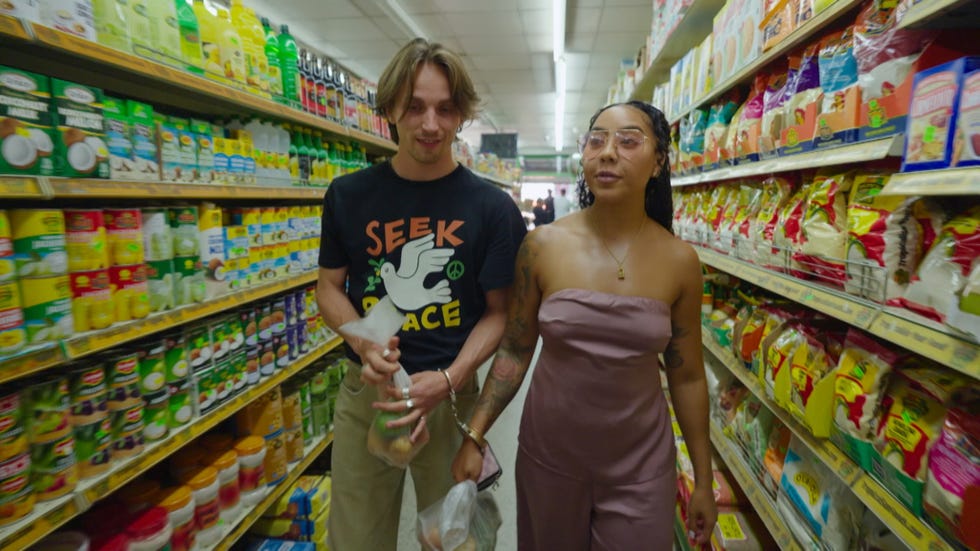 Lin and Frank shopping in a grocery store aisle filled with various products