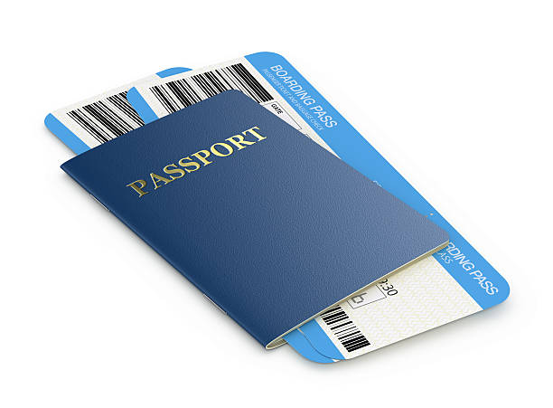 Passport placed over boarding passes, representing travel documents for a flight.