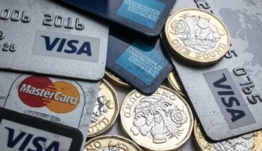 Debit cards and coins representing financial transactions and payments in a business context.