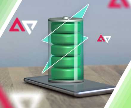 A phone on a table with a full battery above the screen.